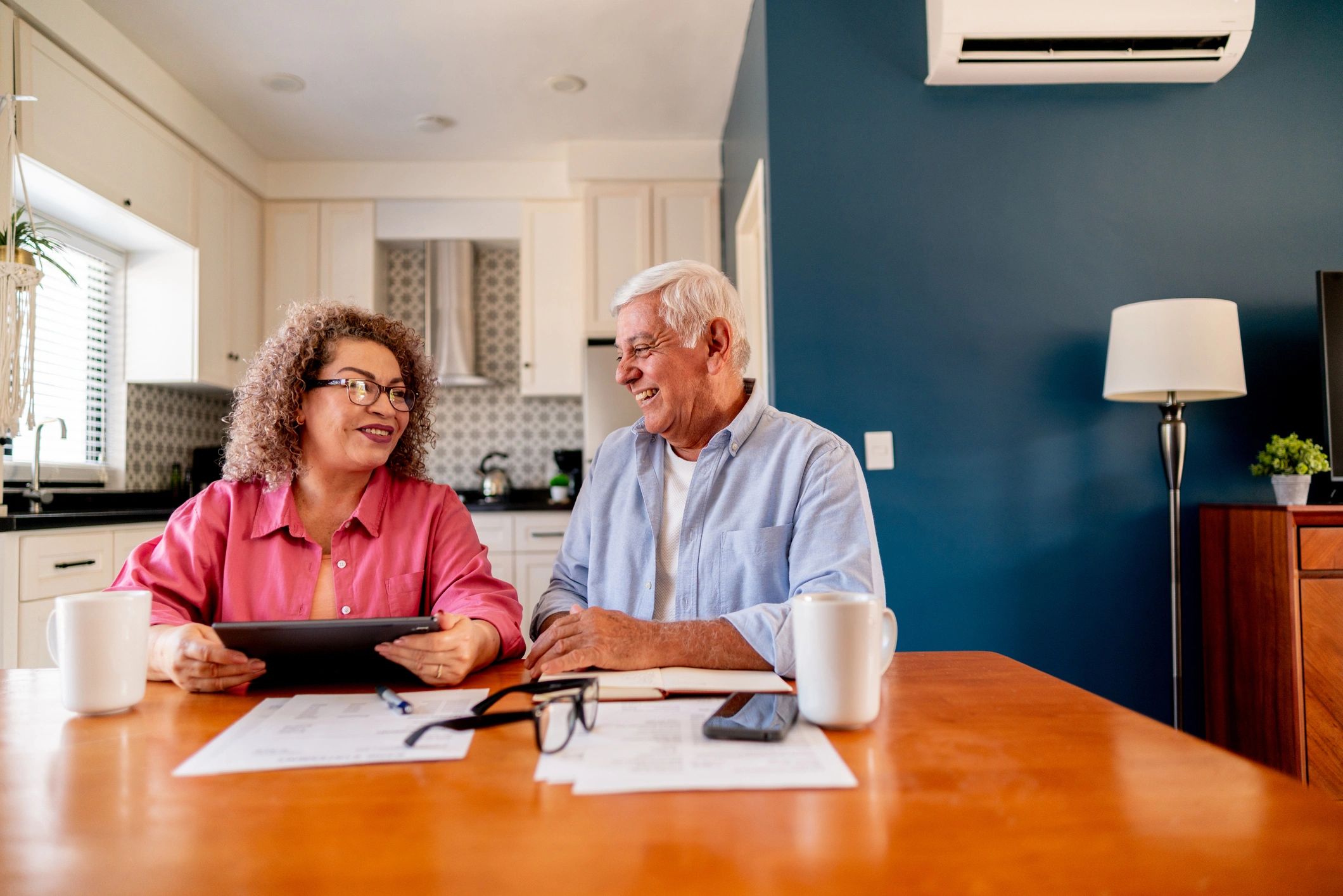 Senior couple reviewing finances at home