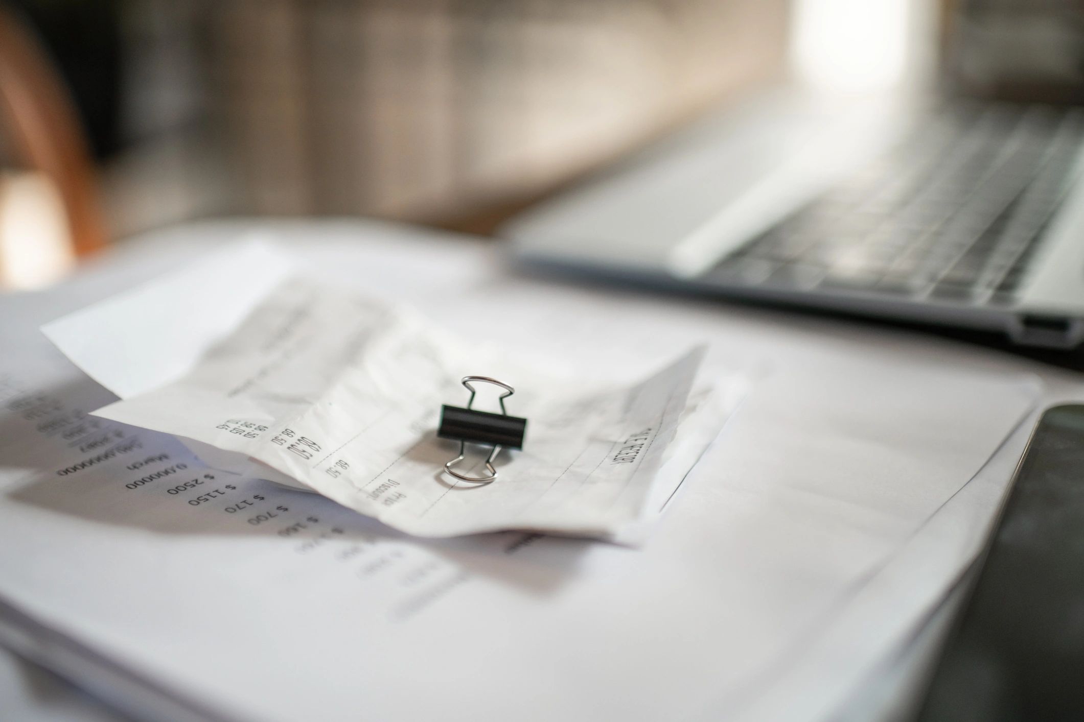 Tax planning documents and laptop on a desk